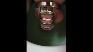 Man Peeing Sitting Locked in Chastity Cage!